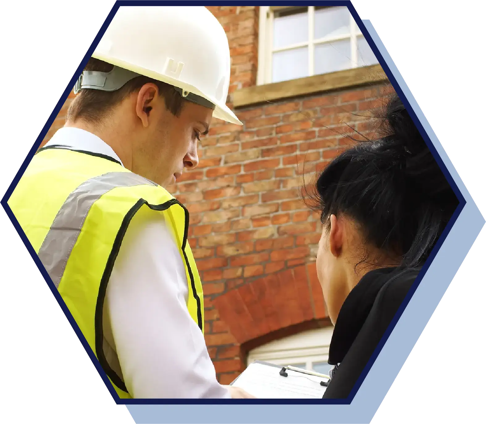 guy inspecting a plan for a building