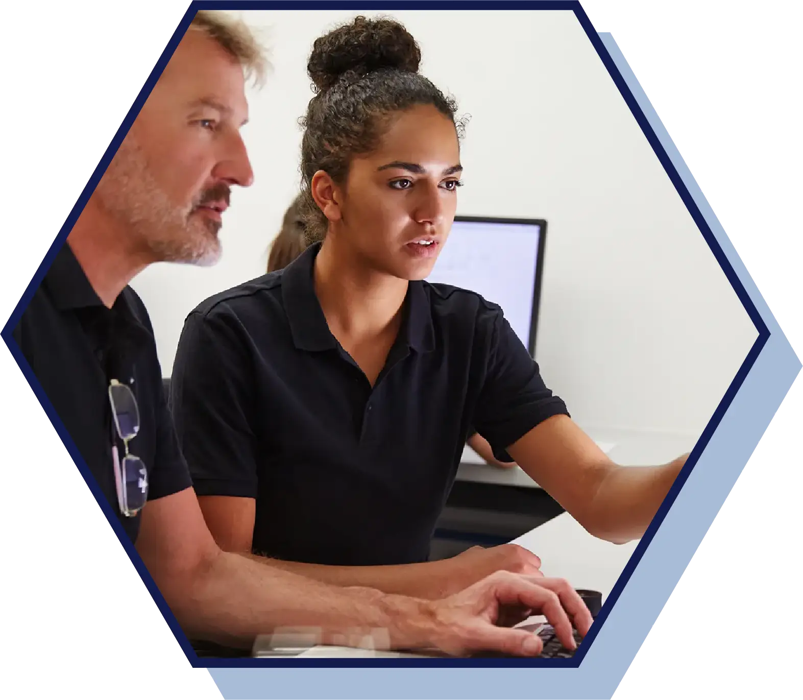 girl watching a guy on a computer