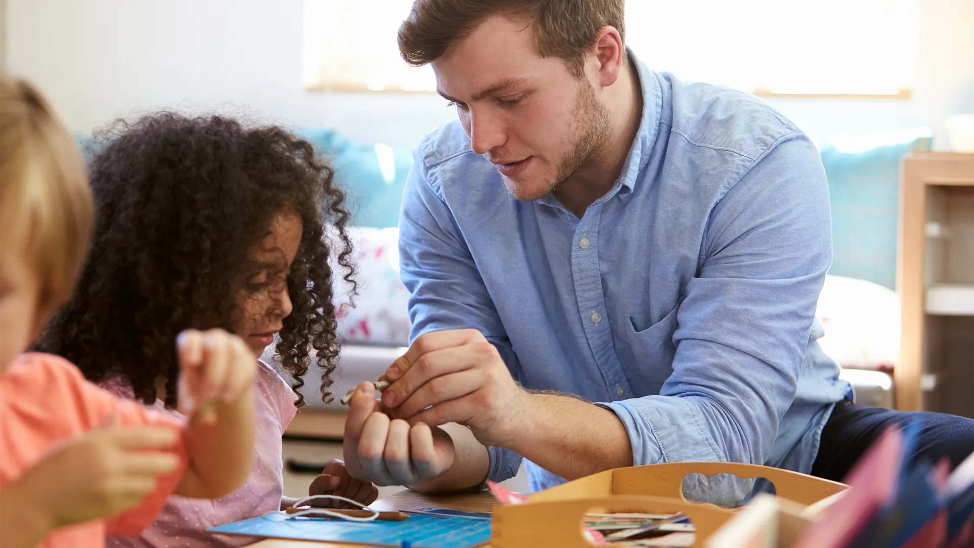 Guy interacting with a child