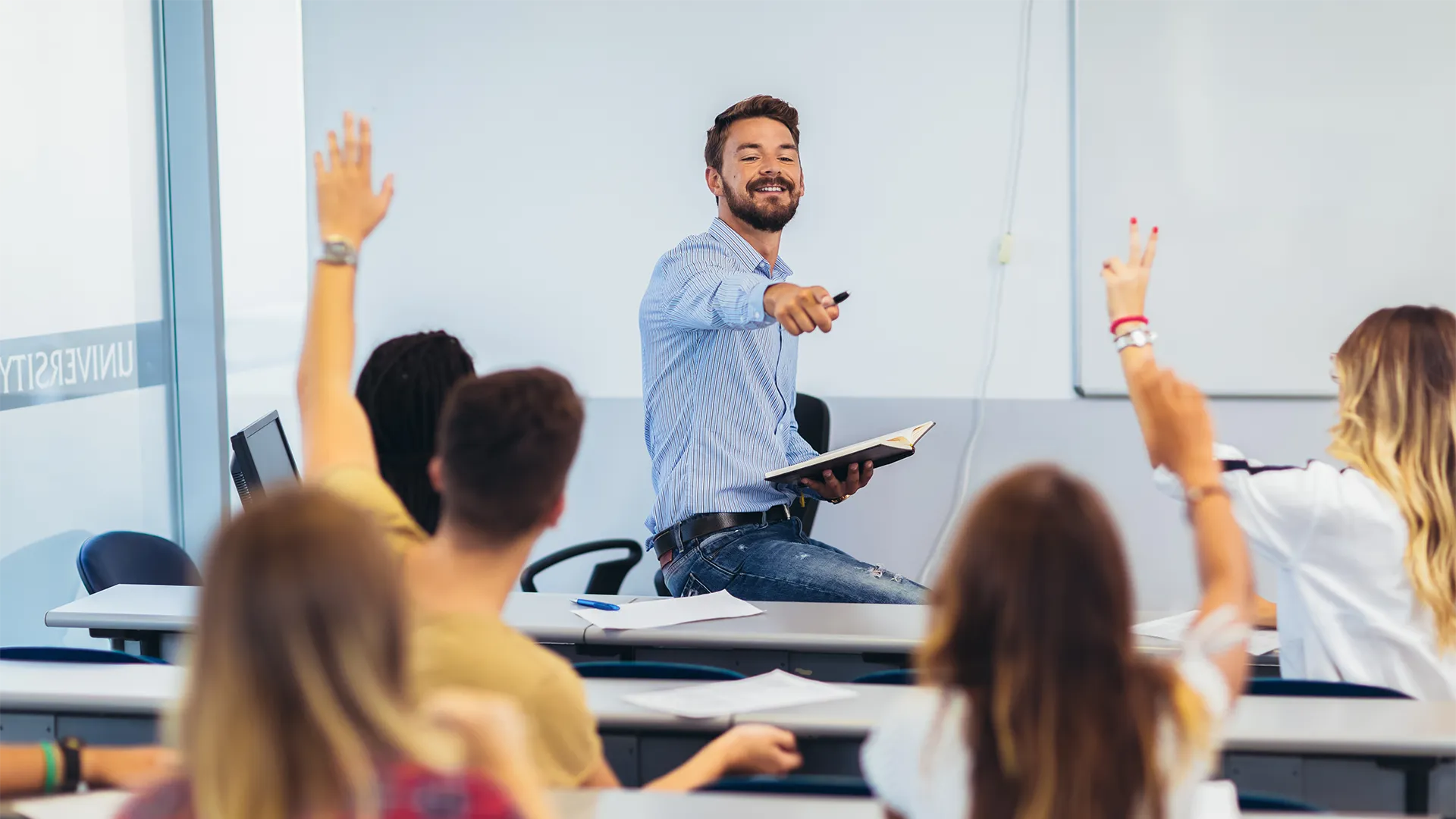 teacher pointing to a child to ask them their answer